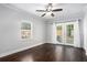 Light bedroom with wood floors, ceiling fan, and patio door at 972 Sims Nw Ave, Atlanta, GA 30318