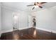 Bedroom showing hardwood floors, a ceiling fan, and an ensuite bathroom with updated fixtures at 972 Sims Nw Ave, Atlanta, GA 30318