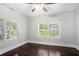 Cozy bedroom with hardwood floors and two large windows at 972 Sims Nw Ave, Atlanta, GA 30318