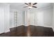 Spacious bedroom featuring hardwood floors, ceiling fan and storage at 972 Sims Nw Ave, Atlanta, GA 30318