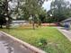 Home featuring a well-manicured front yard and partial view of a carport at 972 Sims Nw Ave, Atlanta, GA 30318