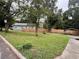 Charming home with a well-manicured front yard, driveway, and partial view of carport at 972 Sims Nw Ave, Atlanta, GA 30318
