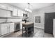 Bright kitchen featuring white cabinets, stainless steel appliances, and a central island at 972 Sims Nw Ave, Atlanta, GA 30318