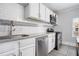 Modern kitchen with white subway tile backsplash, stainless steel appliances, and granite countertops at 972 Sims Nw Ave, Atlanta, GA 30318