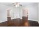 Spacious living room with dark hardwood floors and a decorative fireplace at 972 Sims Nw Ave, Atlanta, GA 30318