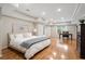Spacious bedroom with hardwood floors, recessed lighting, and a large window at 9985 High Falls Pointe, Johns Creek, GA 30022