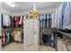 Spacious walk-in closet featuring abundant shelving, hanging racks, and a full-length dressing mirror at 9985 High Falls Pointe, Johns Creek, GA 30022