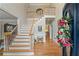 Grand foyer with hardwood floors, staircase, and decorative details creating an inviting and elegant entrance at 9985 High Falls Pointe, Johns Creek, GA 30022