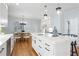 Stylish kitchen with a large center island, sleek countertops, stainless steel appliances, and an adjacent dining area at 9985 High Falls Pointe, Johns Creek, GA 30022