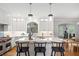Bright, white kitchen with a large island, counter seating, and stainless steel appliances at 9985 High Falls Pointe, Johns Creek, GA 30022