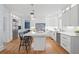 Open kitchen with marble countertops, stainless steel appliances, and a tile backsplash design at 9985 High Falls Pointe, Johns Creek, GA 30022