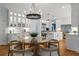 Bright kitchen with ample cabinet space, a large island, breakfast nook, and hardwood floors at 9985 High Falls Pointe, Johns Creek, GA 30022
