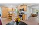 Eat-in kitchen with stainless steel appliances, wood cabinets, granite countertops, island, and breakfast nook at 9985 High Falls Pointe, Johns Creek, GA 30022