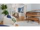 Elegant living room showcasing hardwood floors, sophisticated decor, and seamless flow into a dining space at 9985 High Falls Pointe, Johns Creek, GA 30022