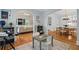 Open-concept living room with hardwood floors, arched doorways, and neutral decor at 9985 High Falls Pointe, Johns Creek, GA 30022