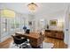 Bright home office with natural light, modern desk, and stylish decor creating a productive workspace at 9985 High Falls Pointe, Johns Creek, GA 30022