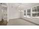 Dining Room with coffered ceiling, large windows, and modern chandelier at 13917 Homer Lane, Covington, GA 30014