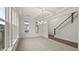 Elegant dining room with coffered ceiling, chandelier, and staircase access at 13917 Homer Lane, Covington, GA 30014