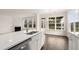 Beautiful kitchen with quartz countertops, a view of a fireplace and stainless steel dishwasher at 13917 Homer Lane, Covington, GA 30014