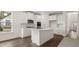 Open-concept kitchen with white cabinets, quartz countertops, and stainless steel appliances at 13917 Homer Lane, Covington, GA 30014