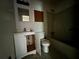 Modest bathroom features a vanity, toilet, and a bathtub at 2369 Christian Cir, Covington, GA 30016