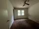 Bedroom with ceiling fan and a window for natural light at 2369 Christian Cir, Covington, GA 30016