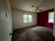 Bedroom with an accent wall and natural light from windows at 2369 Christian Cir, Covington, GA 30016