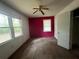 Bedroom with an accent wall and natural light from windows at 2369 Christian Cir, Covington, GA 30016