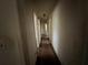 Hallway featuring access to different rooms and simple lighting at 2369 Christian Cir, Covington, GA 30016