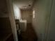 Small laundry room featuring washer, dryer, and water heater at 2369 Christian Cir, Covington, GA 30016