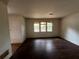 Spacious living room with hardwood floors and natural light from the windows at 2369 Christian Cir, Covington, GA 30016