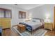 Bedroom featuring hardwood floors, neutral walls, and two windows at 3696 Suwanee Creek Ct, Suwanee, GA 30024