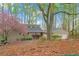 Charming home featuring a well-maintained lawn and mature trees at 3696 Suwanee Creek Ct, Suwanee, GA 30024