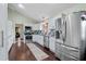 Stylish kitchen with stainless steel appliances and hardwood floors at 3696 Suwanee Creek Ct, Suwanee, GA 30024