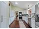 Modern kitchen with stainless steel appliances and granite countertops at 3696 Suwanee Creek Ct, Suwanee, GA 30024