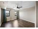 Well-lit bedroom with hardwood floors, neutral walls, and large windows at 795 Hammond Dr # 1707, Atlanta, GA 30328