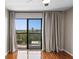 Bedroom featuring hardwood floors and sliding glass doors to a balcony with a view at 795 Hammond Dr # 1707, Atlanta, GA 30328