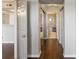 Hallway featuring hardwood floors, doors, and views of a kitchen and a bathroom at 795 Hammond Dr # 1707, Atlanta, GA 30328
