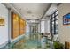 Bright hallway featuring decorative lighting, stylish seating, and sleek design at 795 Hammond Dr # 1707, Atlanta, GA 30328