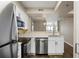 Modern kitchen featuring stainless steel appliances, white countertops, and stylish design at 795 Hammond Dr # 1707, Atlanta, GA 30328
