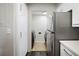 View of laundry area and stainless steel refrigerator at 795 Hammond Dr # 1707, Atlanta, GA 30328