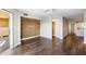 Contemporary living room with hardwood floors, modern shelving, and a balcony access at 795 Hammond Dr # 1707, Atlanta, GA 30328