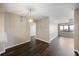 Open-concept living space with hardwood floors, dining area, and ample natural light at 795 Hammond Dr # 1707, Atlanta, GA 30328