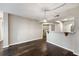 Relaxing living area with wood floors, open counter to the kitchen, and pendant light fixture at 795 Hammond Dr # 1707, Atlanta, GA 30328