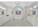Bright bathroom features a soaking tub, dual sinks, and a large arched window at 103 Candler Loop, Acworth, GA 30101