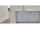 A bright bathroom vanity with gray cabinets and a quartz countertop at 103 Candler Loop, Acworth, GA 30101