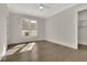 Sunlight streams through the window of this bedroom with hardwood floors and neutral walls at 103 Candler Loop, Acworth, GA 30101