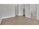 Spacious bedroom with wood floors, walk-in closet, ensuite bathroom, and neutral paint scheme at 103 Candler Loop, Acworth, GA 30101