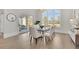 Light-filled dining room with modern furniture, chandelier, and access to the patio at 103 Candler Loop, Acworth, GA 30101