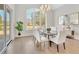Bright dining room features a large window, chandelier, and neutral decor at 103 Candler Loop, Acworth, GA 30101